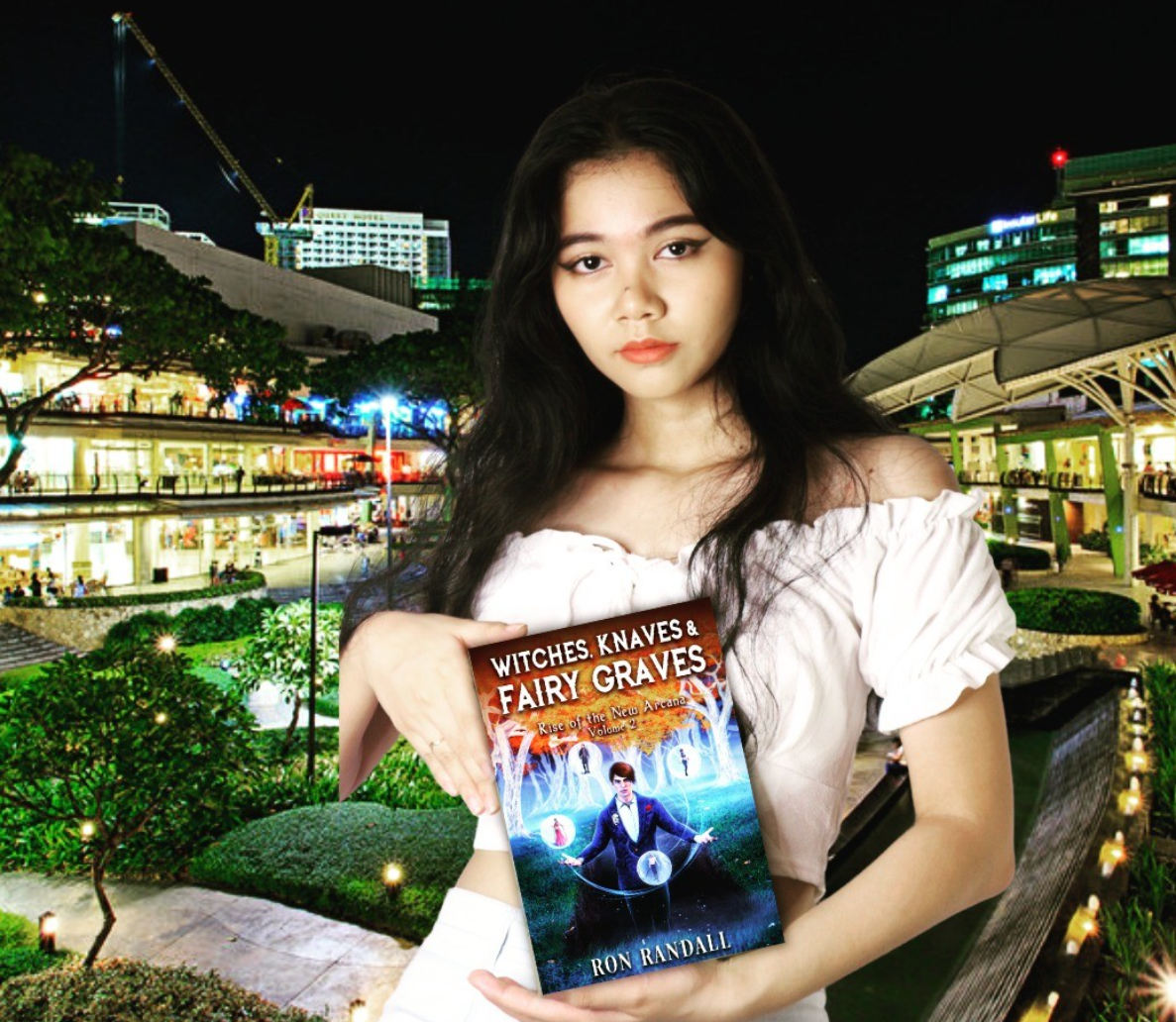 Faith portraying Esmerelda while holding Witches, Knaves and Fairy Graves